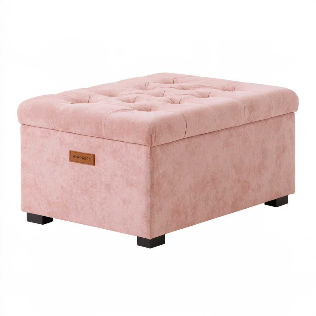 Pink velvet storage bench with tufted top and black feet, ideal for living room decor in a modern home.